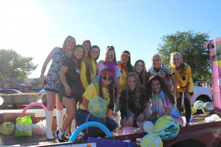 Girls Soccer throws back with their 60s themed float.