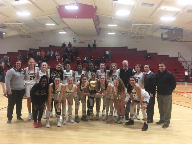 The Lady Sandies pose with the Regional Quarter Final trophy