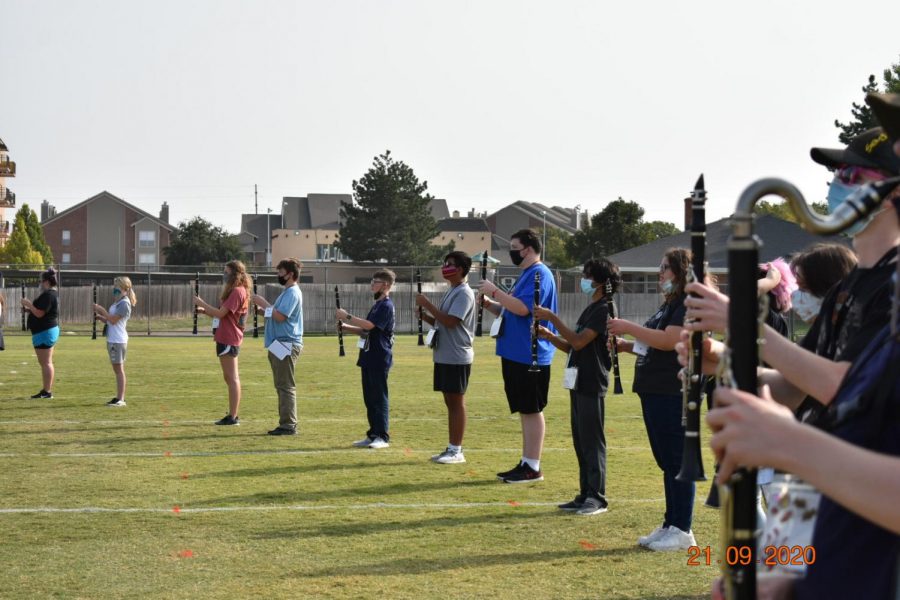 Clarinets start to learn this years program in masks. The band used masks and instrument covers this year to help protect the students 