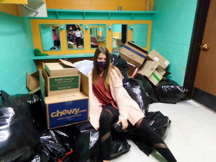 Klair Soukup takes a break while cleaning and organizing the new theatre space. The cancellation of the fall production has allowed the production students to clean out the space. 