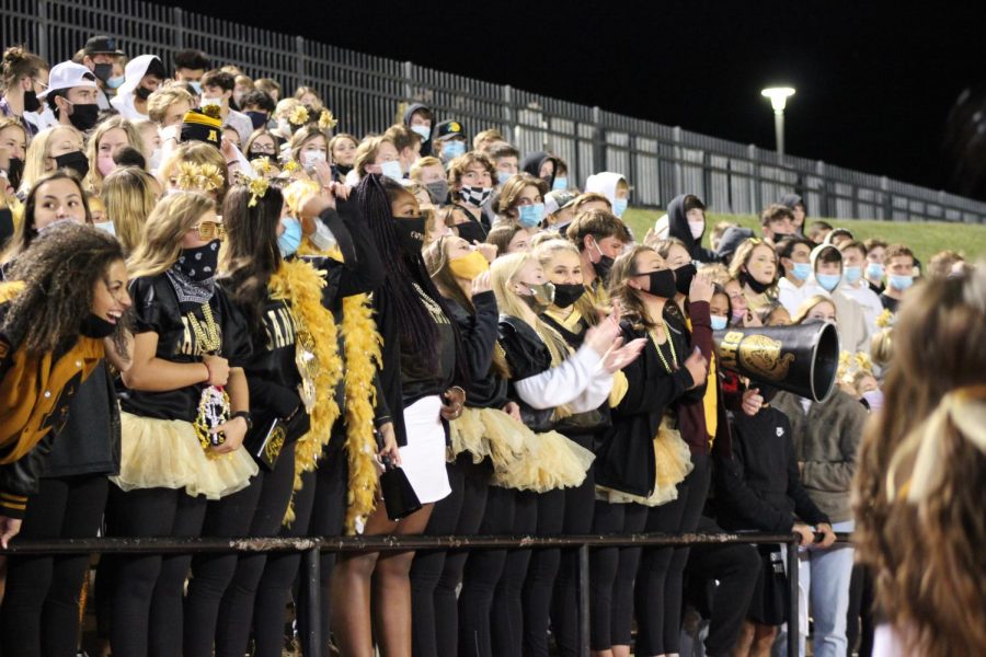 The football ladies cheer on the Sandies at the Spirit Week game against Tascosa