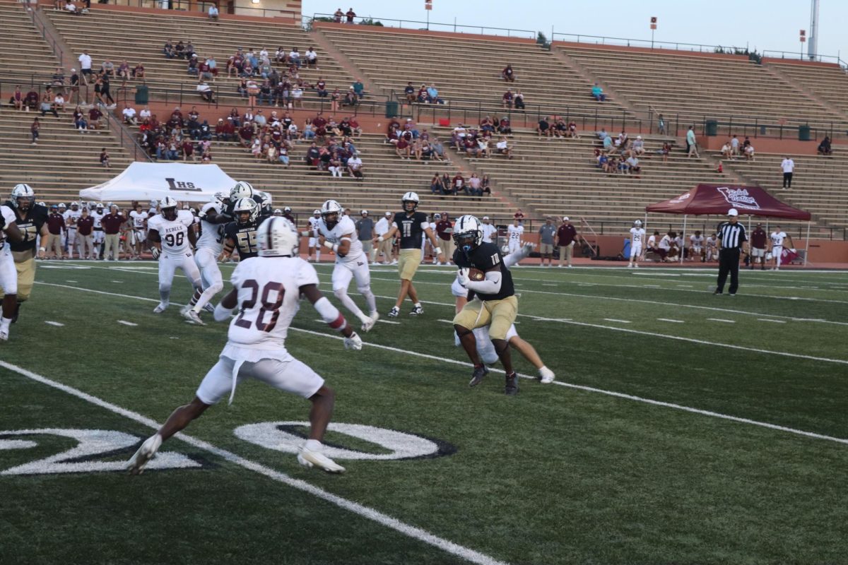 Sandies run the ball during the game against Midland Legacy