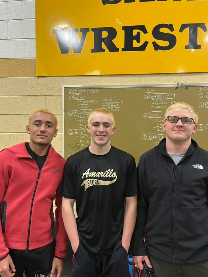 The state wrestlers wait before exiting for their send-off. 