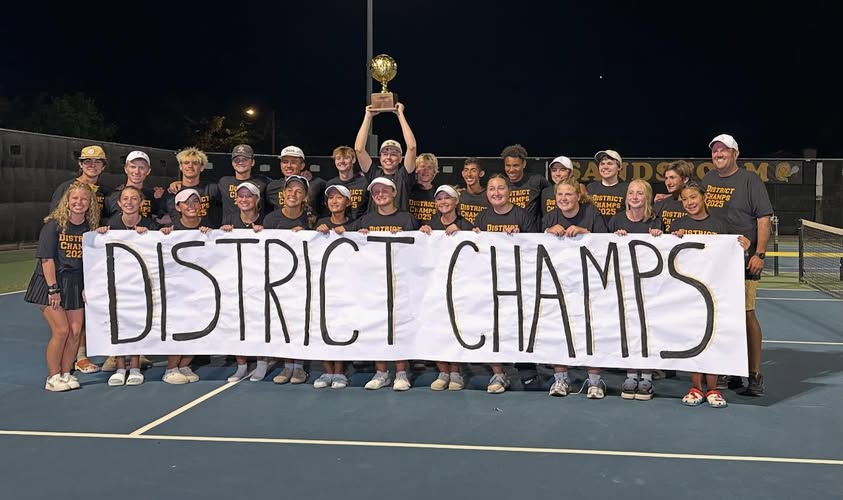 Tennis team celebrates their District Championship win